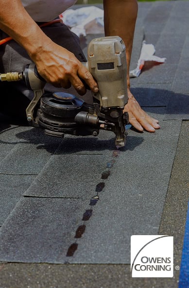 A person uses a nail gun to install asphalt shingles on a roof in Florida; the Owens Corning logo and Pantheon Roofing branding are visible in the corner.