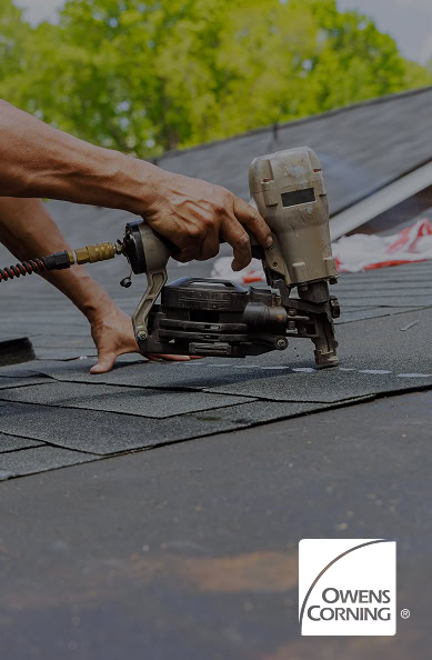 A person using a nail gun to install shingles on a roof, with trees in the background, the Owens Corning logo in the corner, and Pantheon Roofing showcasing quality work in Florida.